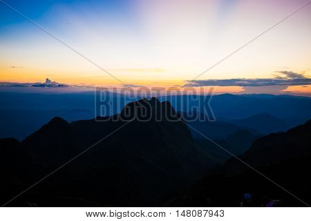 Mountain Silhoette Of Sub Alpine At Sunrise Glowing Sky