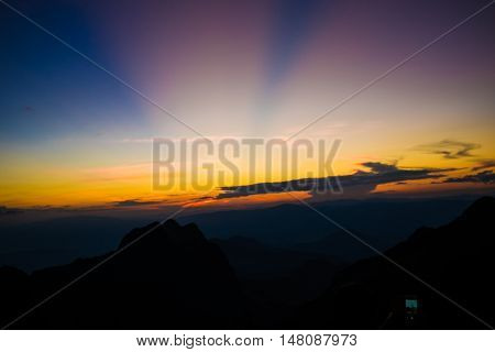 Mountain Silhoette Of Sub Alpine At Sunrise Glowing Sky