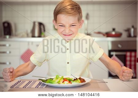 Angry Hungry Boy Banging His Fist On The Table