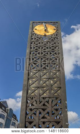 Modern metal clock on the Forum square in Bielefeld Germany