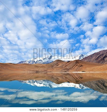 Mountains reflection in Thatsang Karu lake in the Indian Himalayas Ladakh Jammu and Kashmir state North India