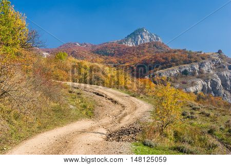 Back road in autumnal mountains - mountain pasture Demerdzhi Crimea Ukraine.