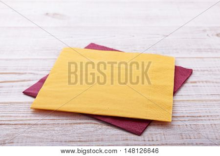 paper napkin on old wooden table close up. place for text