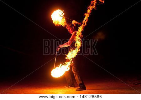 RUSSIA, BALTIYSK - JULY 06, 2014: The unknown artists demonstrate the fire show at the open festival «BALTIC FIRE FEST - 2014» on july 06, 2014 in Baltiysk, Kaliningrad region.