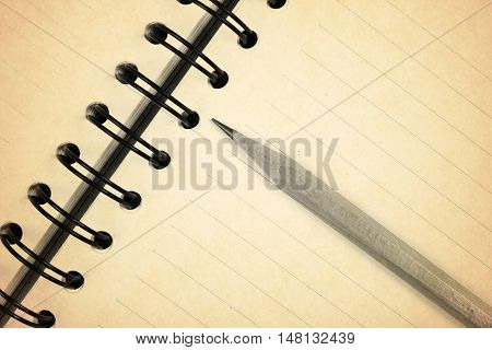 old recycle notebook with pencil for environment and the earth close-up