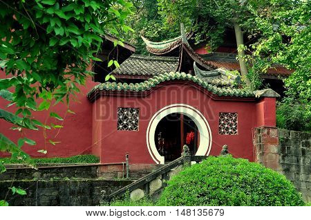 Langzhong Ancient City China - October 22 2013: A classic Chinese moongate leads to the tomb of the revered ruler Zhangfei at the historic Huanzhou Temple