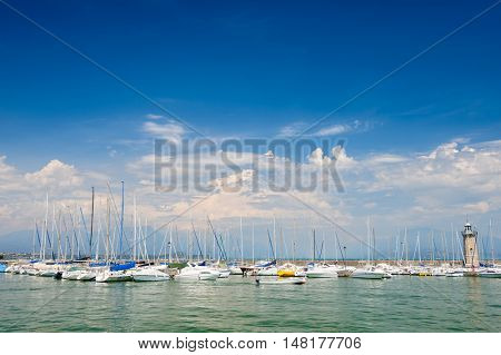 Desenzano, Lombardy, northern Italy, 15th August 2016: Small yachts and boats in harbor of Desenzano del Garda, lake Garda, Italy