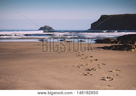 Footprints In The Sand On Polzeath Beach Vintage Retro Filter.