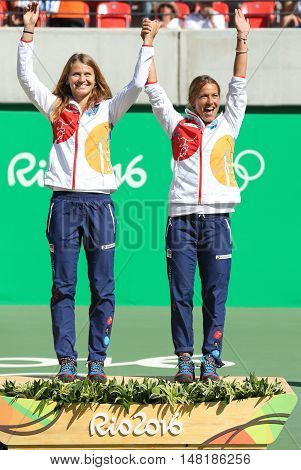 RIO DE JANEIRO, BRAZIL - AUGUST 14, 2016: Bronze medalists team Czech Lucie Safarova (L) and Barbora Strycova during medal ceremony after tennis women's doubles final of the Rio 2016 Olympic Games