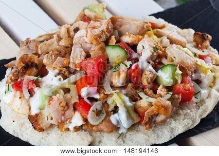 shawarma still life on a plate meat chicken cabbage carrot onion pepper Isolated white background pita