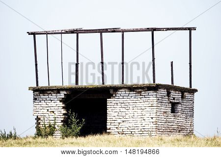 Deserted white brick object in the field
