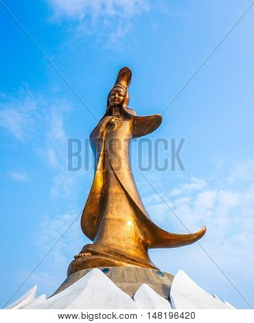 statue of Kun Iam against blue sky in macau. It is very popular with tourists and foreigners