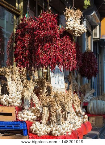 Street Retail Outlet selling Harvest of fresh and dry red Pepper and White Garlic in Istanbul City Turkey