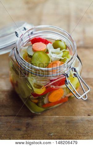 Pickled vegetables in glass jar