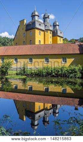 Castle Of Schloss Holte-stukenbrock With Reflection In The Water