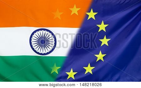 India and European Union relations concept with diagonally merged real fabric flags