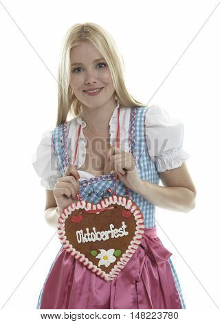 Woman with German Lebkuchen heart in front of white background