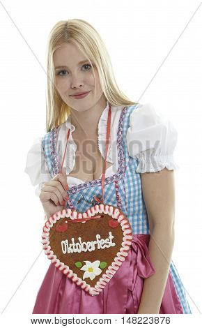 Woman with German Lebkuchen heart in front of white background