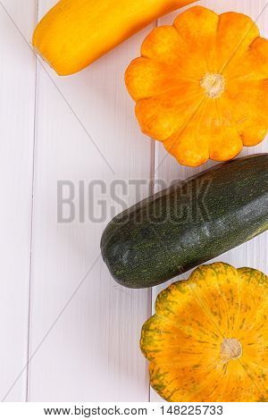 Group of autumn squash over a white background