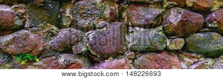 Close up of old stone wall background. Panoramic picture.