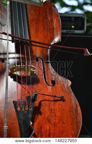 Old restored wooden jazz contrabass on stage