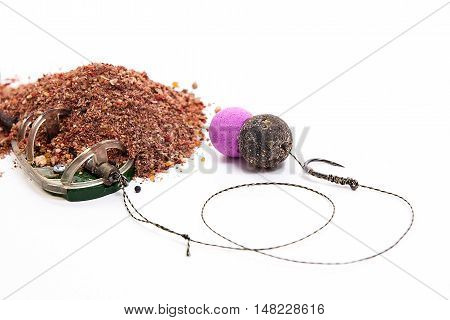 Dry Feed For Carp Fishing. Ready For Use Carp Bait With Fishing Flat Feeder For Carp Fishing Isolate