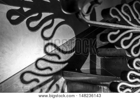BARCELONA, SPAIN - SEPTEMBER 20, 2014: Creative shadow on the wall. Staircase inside Palace Guell. Design by Antonio Gaudi.