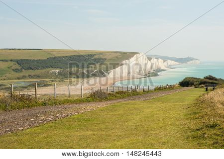 View towards the Seven Sisters chalk cliffs and Beachy Head from Seaford Head. East Sussex England