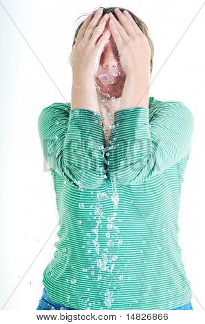bautiful young woman wash face with clean water isolated on white in studio