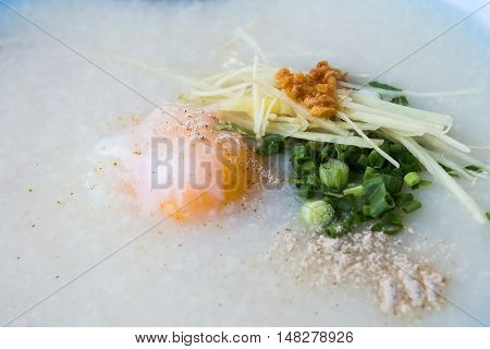 Congee with pork and boiled egg for breakfast