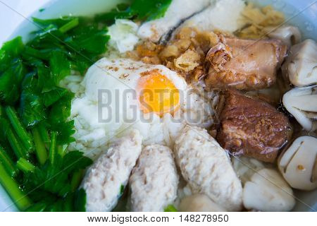 Rice porridge with many  pork and egg