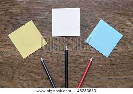 White Paper And Pencil On Wooden Table