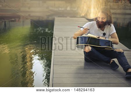 Guitarist writing a new composition