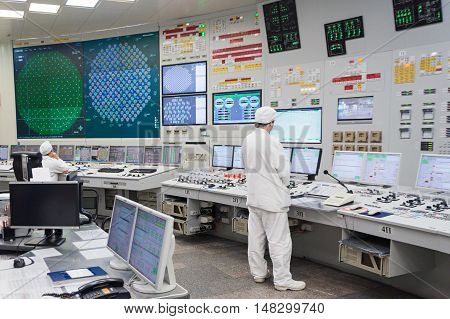 KURCHATOW, RUSSIA - JUNE 23, 2016: The operator monitors the readings of devices and work equipment. Central control unit of Kursk NPP.