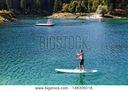 Man On A Paddleboard At Caumasee, Switzerland