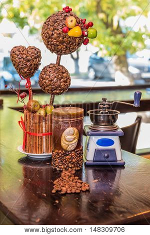Coffee grinder candle. coffee tree and coffee beans