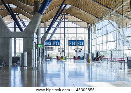 Madrid Spain: 16th July 2016: The Madrid-Barajas Airport is Spain's largest and busiest airport characterised by a floating roof propped by an internal coloured structure.