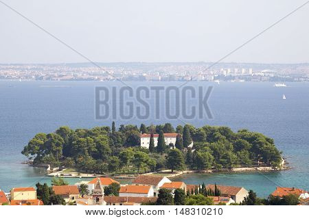 Island Galevac with Franciscan monastery and Croatian town Preko