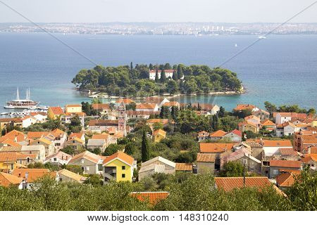 Island Galevac with Franciscan monastery and Croatian town Preko