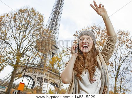 Young Woman Using A Mobile Phone And Handwaving