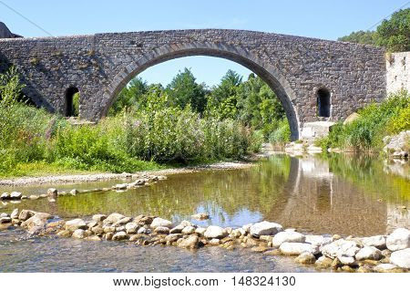 Vieux Bridge In Lagrasse And The Reflection In The River