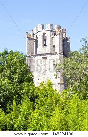 Saint Marie Abbey In Lagrasse Surrounded Of Trees In France