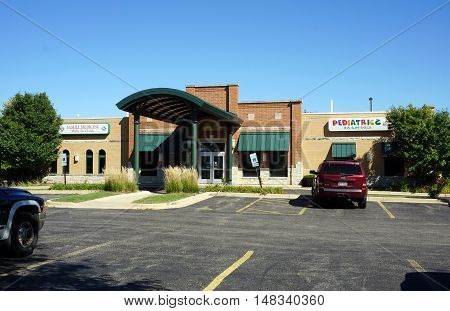 PLAINFIELD, ILLINOIS / UNITED STATES - SEPTEMBER 19, 2016: One may receive medical care at  the Family Medicine Walk In Clinic, and brings one's children to Kids First Pediatrics, in Plainfield.