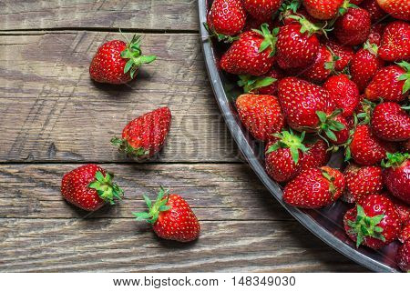 Fresh strawberry on wooden background, autumn crop
