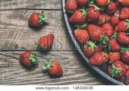 Fresh strawberry on wooden background, autumn crop