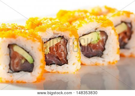 Maki Sushi with Masago  - Roll made of Fresh Raw Salmon, Avocado inside. Masago (smelt roe) outside