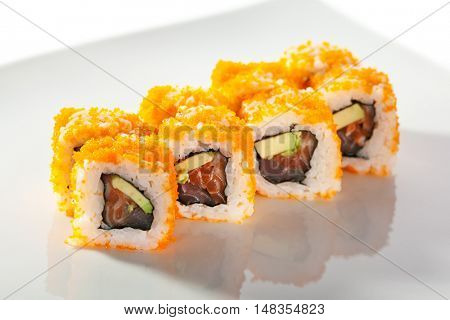 Maki Sushi with Masago  - Roll made of Fresh Raw Salmon, Avocado inside. Masago (smelt roe) outside