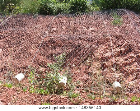 Mesh for protection against rockfall. Montenegro summer.