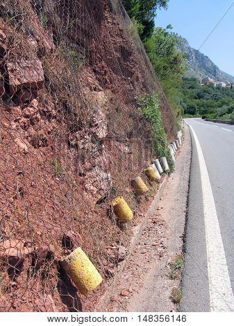 Mesh for protection against rockfall. Montenegro summer.