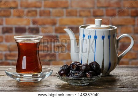 Tea with dates. Tea time. Selective focus
